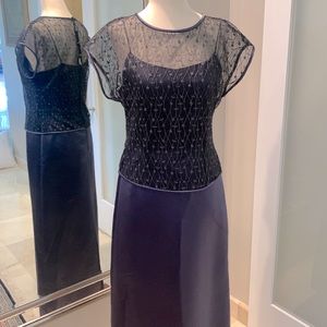 Satin evening gown with sheer embroidered overlay